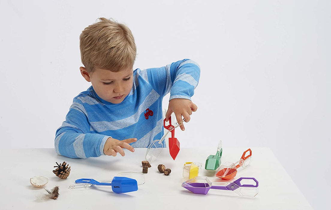 Child playing with Tickit Fine Motor Tongs